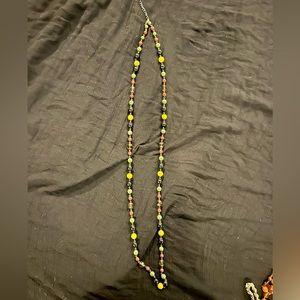 Extra long beaded necklace.